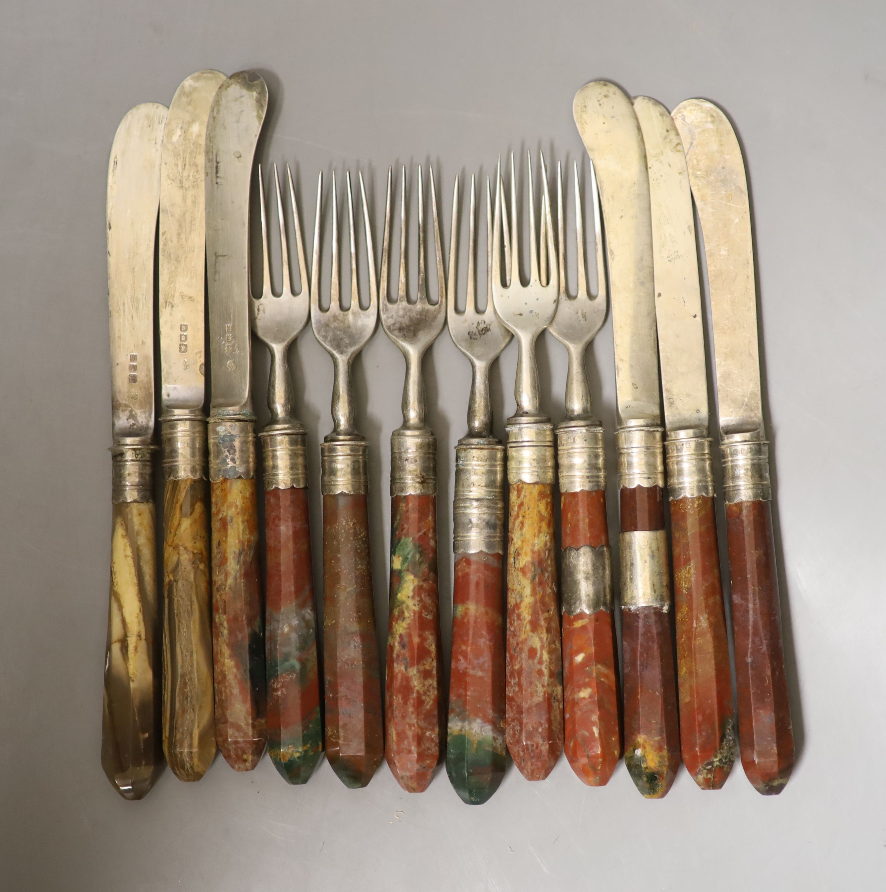 A set of six pairs of George V agate handled silver dessert eaters, Wakely & Wheeler, London, 1922, knife 21cm.